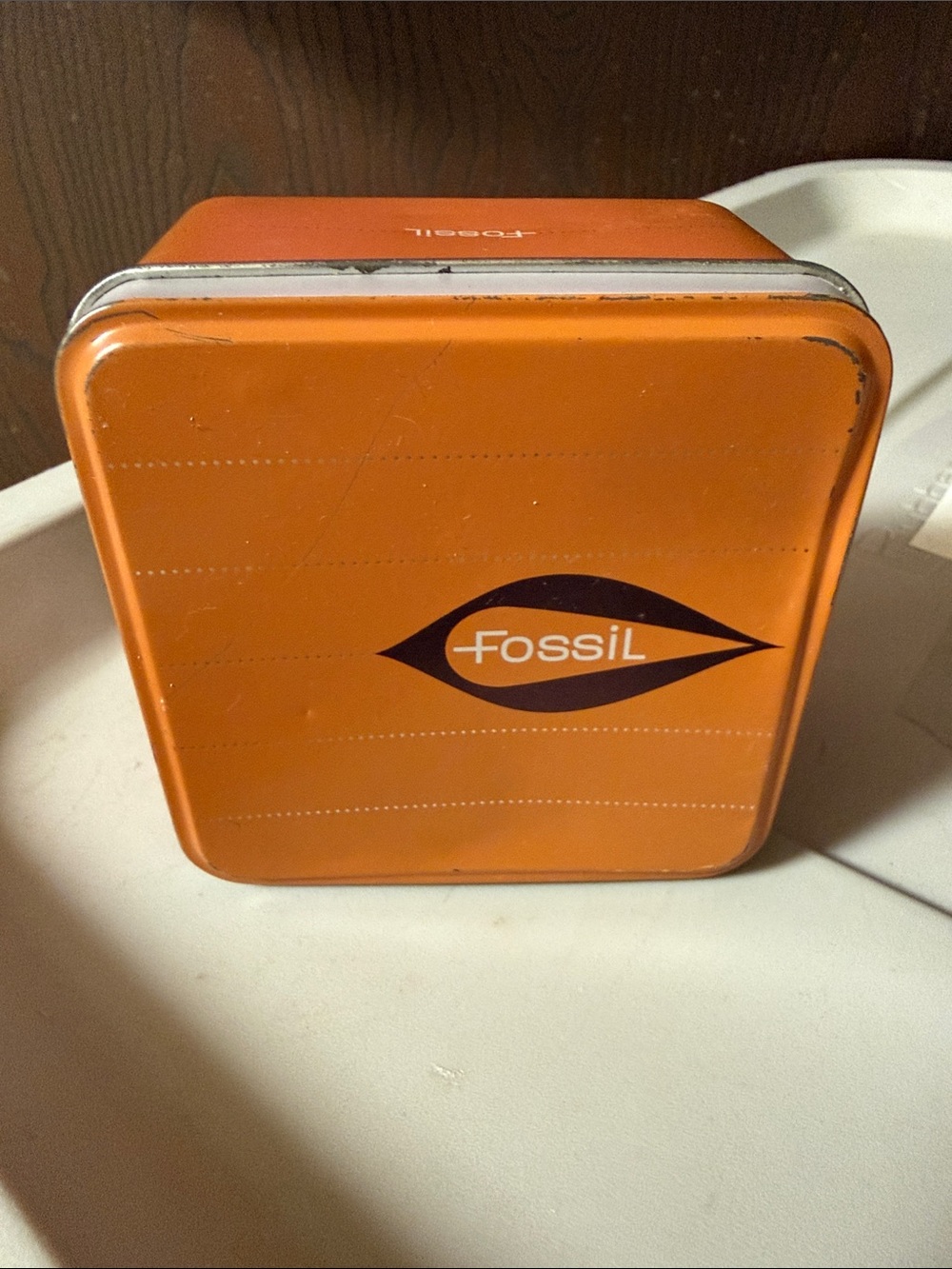 Fossil Orange Metal Storage Tin with Dark Logo